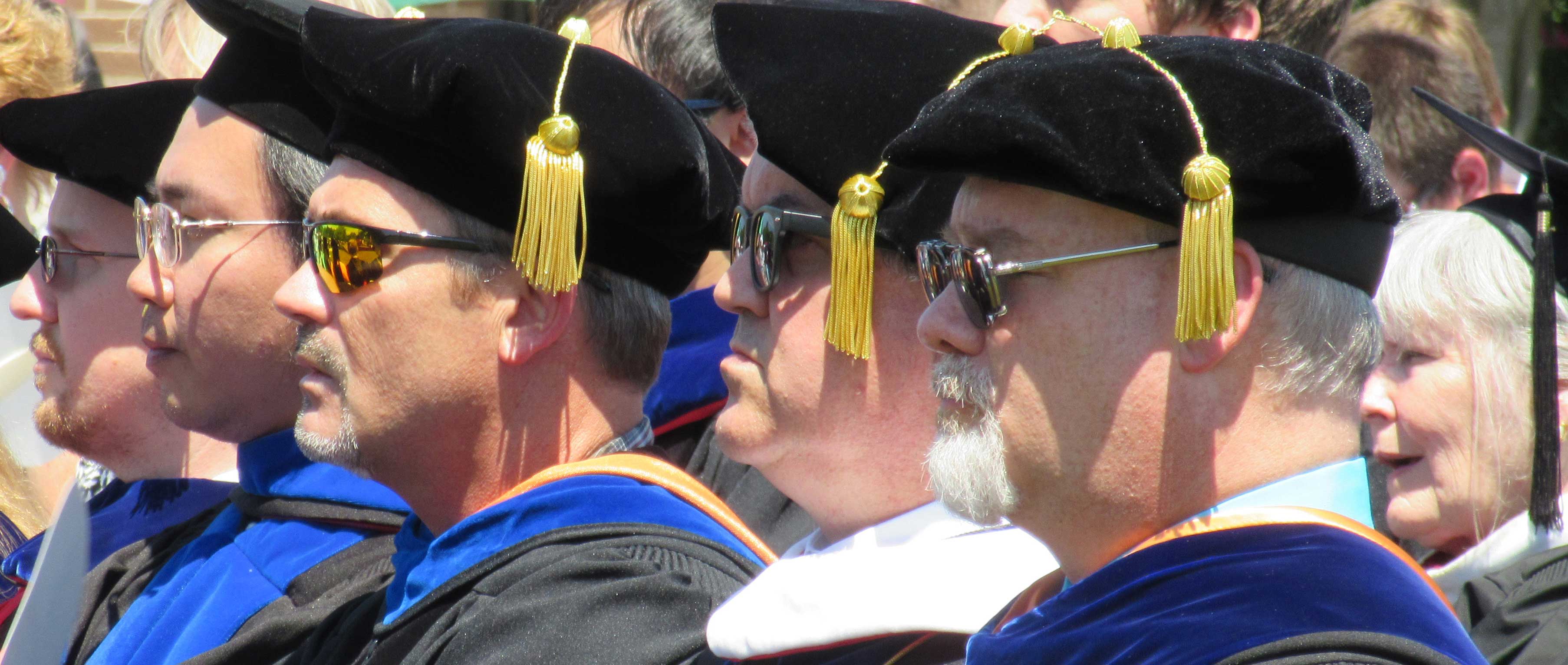 Faculty members in full regalia during commencement exercises.