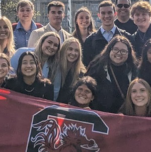 students holding gamecock flag in UK