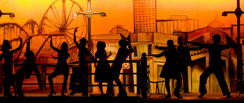 Students in silhouette in a production