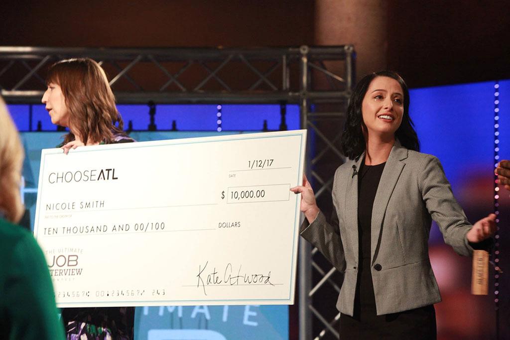 Nicole is presented with the proverbial "large check" when they announced her winner of the contest. 