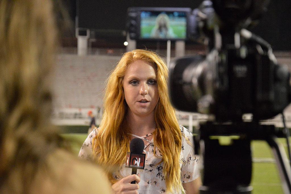Katie Anger, a senior broadcast journalism major, reporting from the South Carolina/Georgia football game.