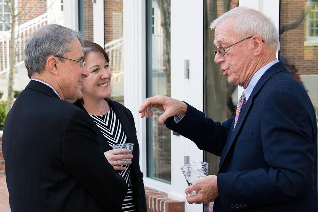 Boston Globe Editor at Large Robby Robinson, right, was honored at a pre-lecture reception. Here he chats with Randy Covington, director of Newsplex, and Cindy Justice, Assistant Dean for Student Services.