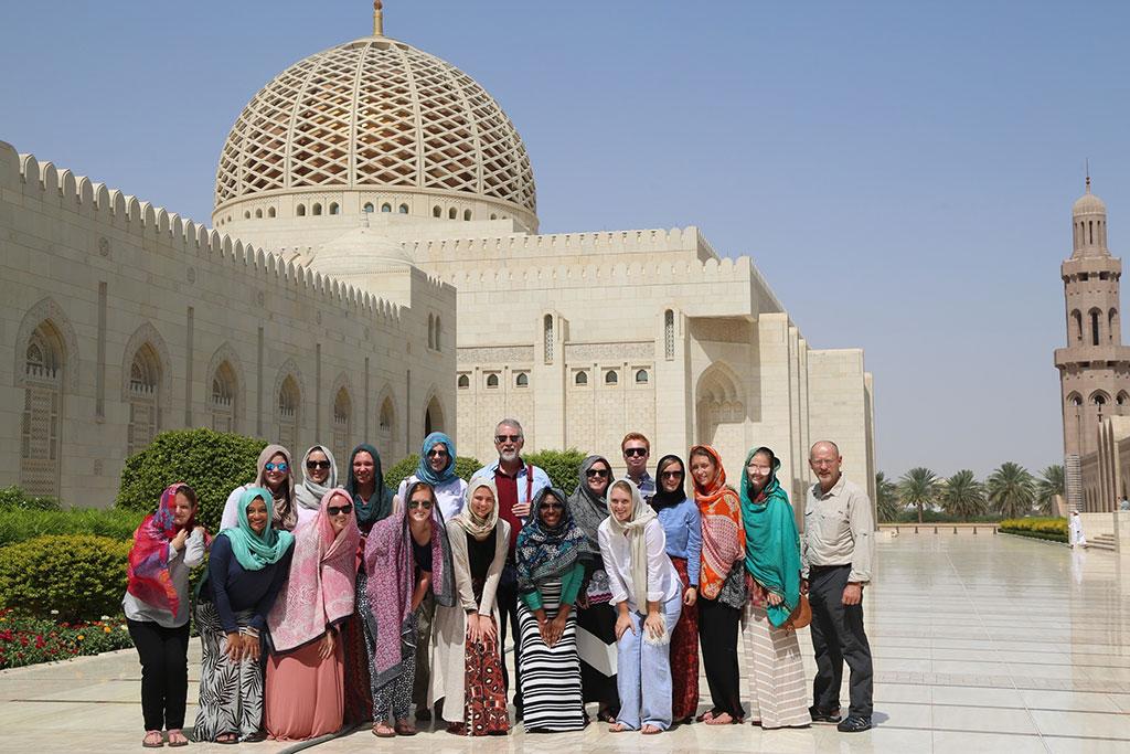 USC Maymester in Oman class outside the Sultan Qaboos Grand Mosque in Muscat, Oman. Pictured back row, center, deputy provost Helen Doerpinghaus and vice provost and director of Global Carolina Allen Miller.
