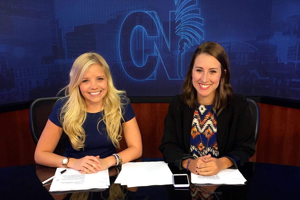 Madisyn and classmate on the set of Carolina News.