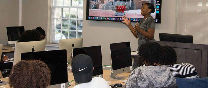 Denetra Walker teaches students at the Digital Media Academy