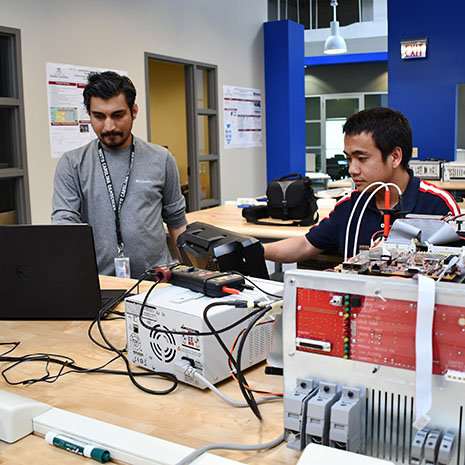 GRad students working in Abdel Nasiri's Lab