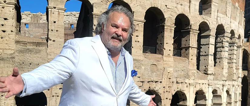 Research professor Rich Harrill poses for a photo in front of the Colosseum in Rome, Italy.