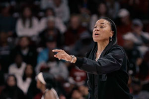 basketball coach dawn staley coaches from the sideline during a game
