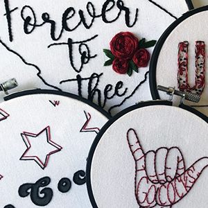 Four of Allison Lambert's UofSC-themed embroidered artworks, from L to R: 