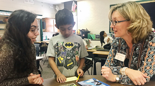 Beth White works with student and teacher