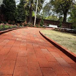 In the garden, the brick pathways go from solid to multicolors, representing the university's desegregation.