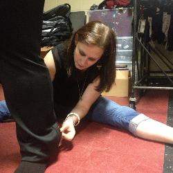 Alexis Doktor hems the pants of the UofSC marching band color guard.