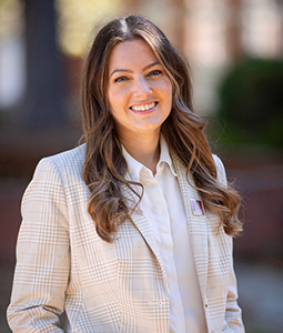 Headshot of Alyssa Blickensderfer outdoors in a suit. 