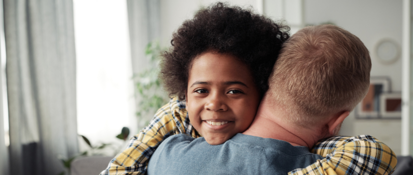 child hugging parent 
