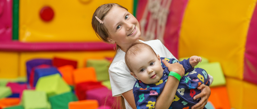 two kids in a ball pit