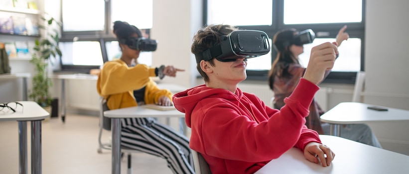 Students using virtual reality headsets in a classroom setting