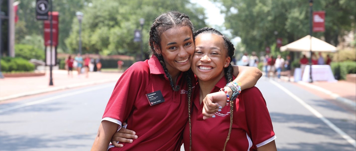 Dominique Harris and fellow Orientation Leader Damari Johnson pose for a picture on Greene Street during the Summer 2021 sessions of Orientation.