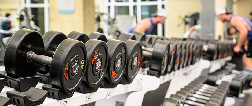 student working out in the strength conditioning room