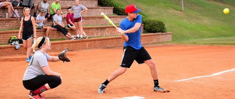 Students playing intramural softball.