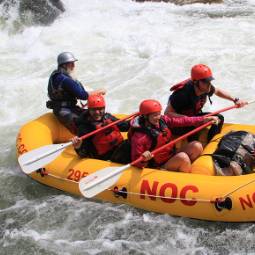 Students participating in white water rafting.