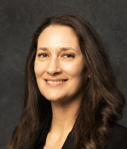 woman with black hair simling