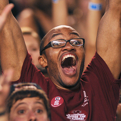 An excited student yelling at a Gamecock sporting event.