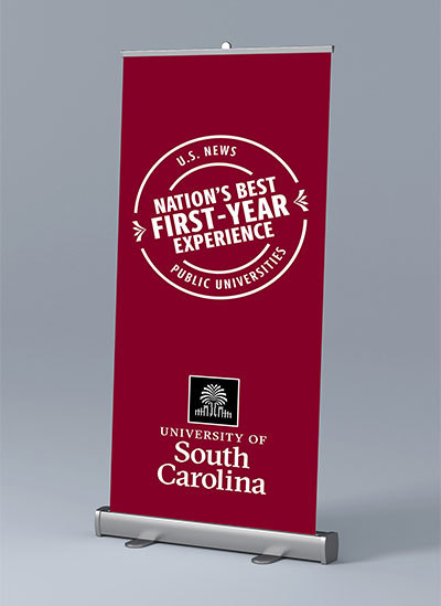 Pop up banner with the USC stamp with text Nation's Best First Year Experience and the University of South Carolina logo on a garnet background.