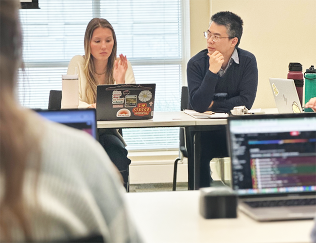 Matthew Lai in classroom with students