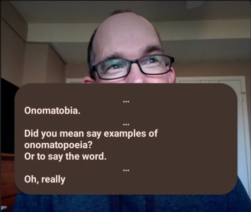 Screenshot of Android live captions over a face in a Teams meeting. The captions say 'Onomatobia. Did you mean say examples of onomatopoeia? Or to say the word. Oh, really.'