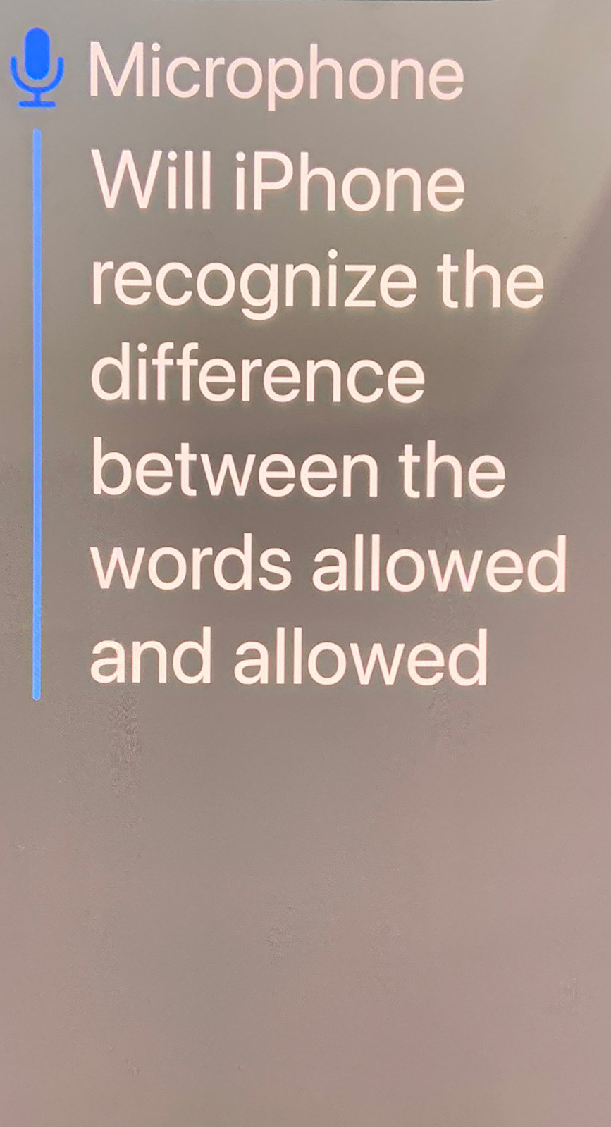 Screenshot of iPhone live captions. The microphone is on with the text Will iPhone recognize the difference between the words allowed and allowed.