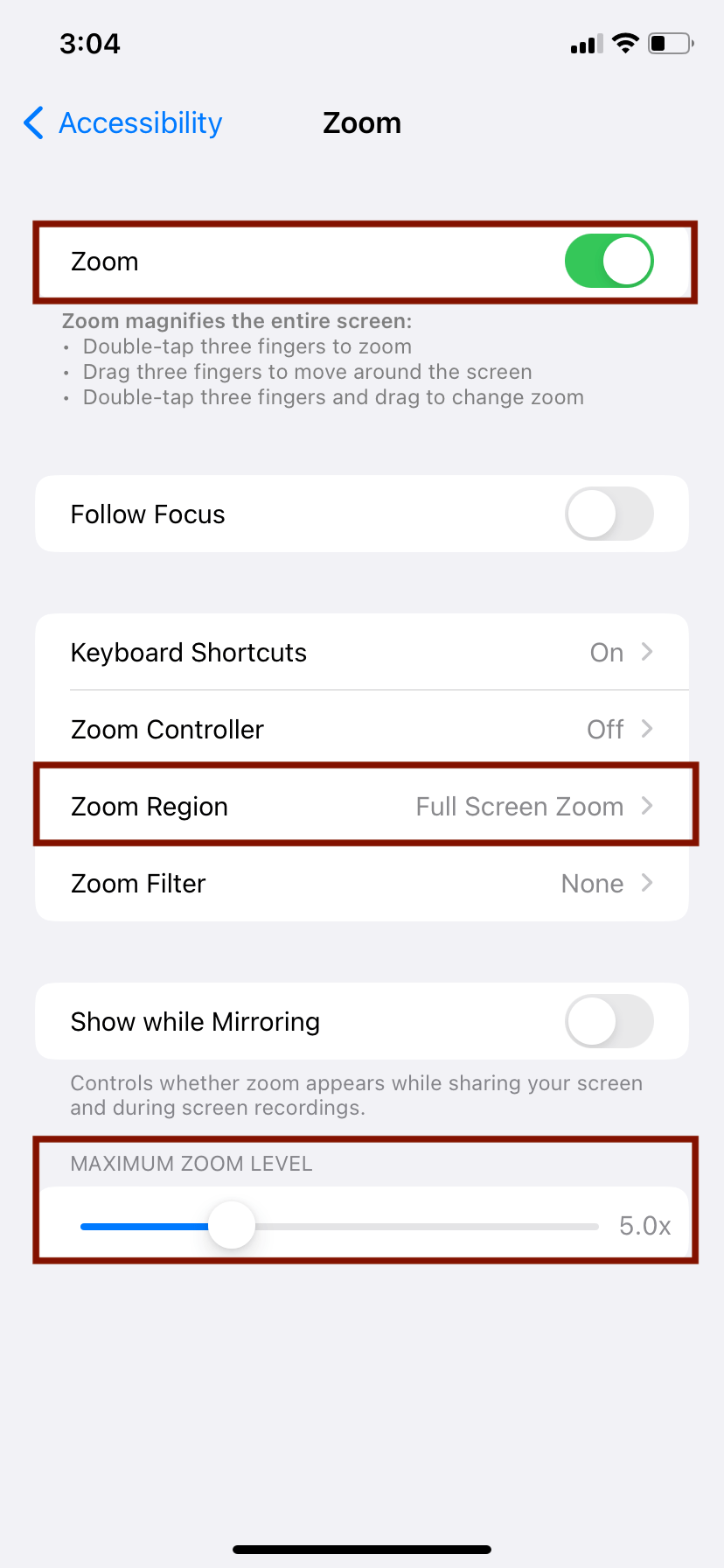 Screenshot of iPhone Zoom settings. Zoom is toggled on with the region full screen zoom selected, and the zoom level slider is set to 5x.