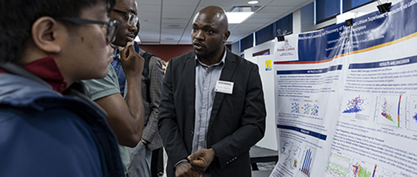AI Day poster presenter shares research with attendees