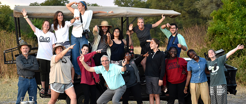 a group of diverse students on a safari 