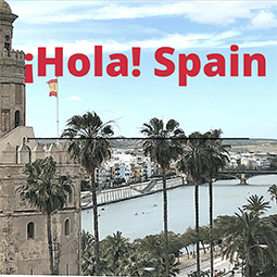a senic picture of seville, spain with the spanish flag.