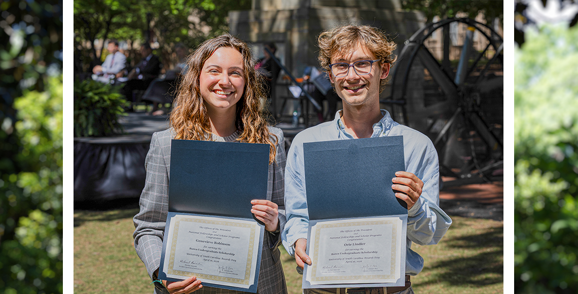 Genevieve Robinson and Orie Lindler holding award certificates