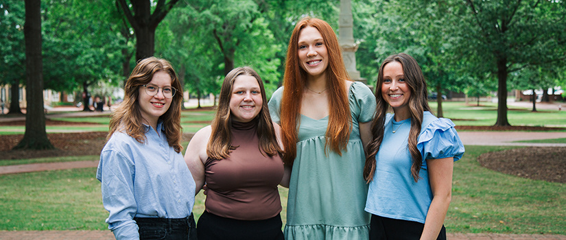USC's four newest Hollings Scholars stand together on the Horseshoe