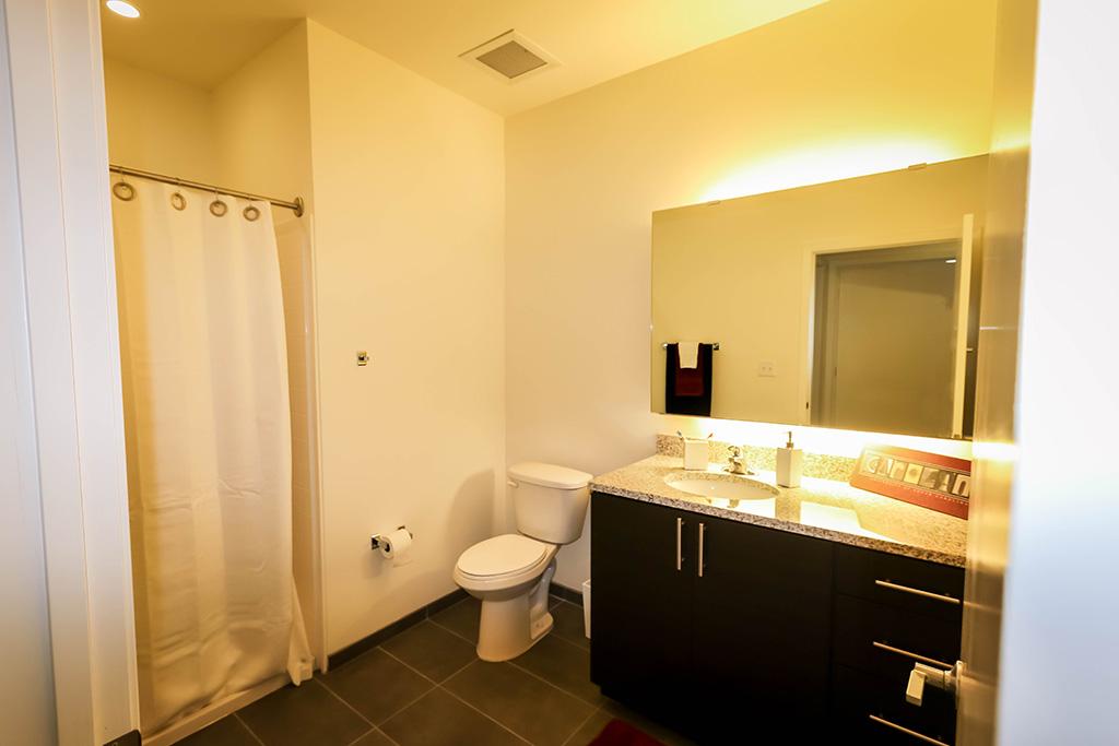 Full bathroom with large sink area.