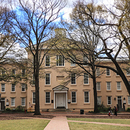In the foreground the historic trees of the horseshoe begin to bloom as Rutledge residence hall is in the background