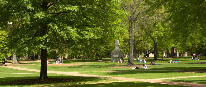 The Maxcy Monument rises from the center of the historic horseshoe surrounded by old trees