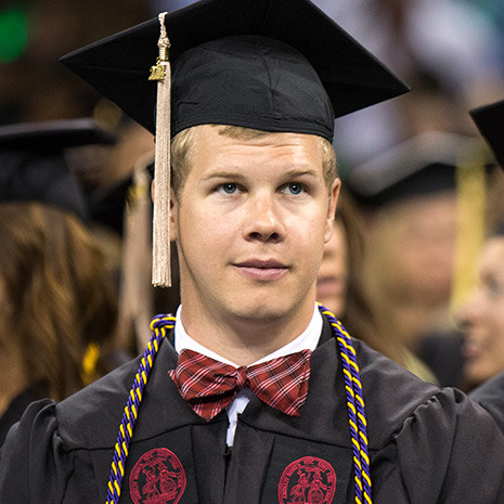 male student at commencement ceremony