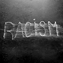 Racism being wiped of chalkboard