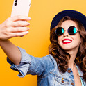 Woman holding phone for a selfie