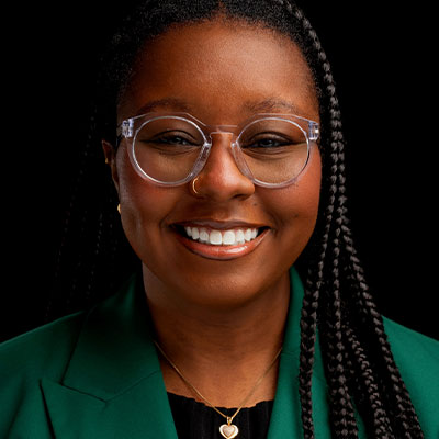 A professional headshot photograph of Dr. Jazmine Benjamin.