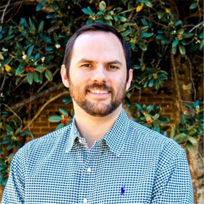 Professional headshot showing Dr. William Capell.