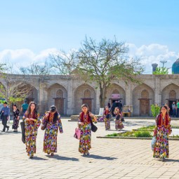 Scenic photo of Uzbekistan with people in traditional dress