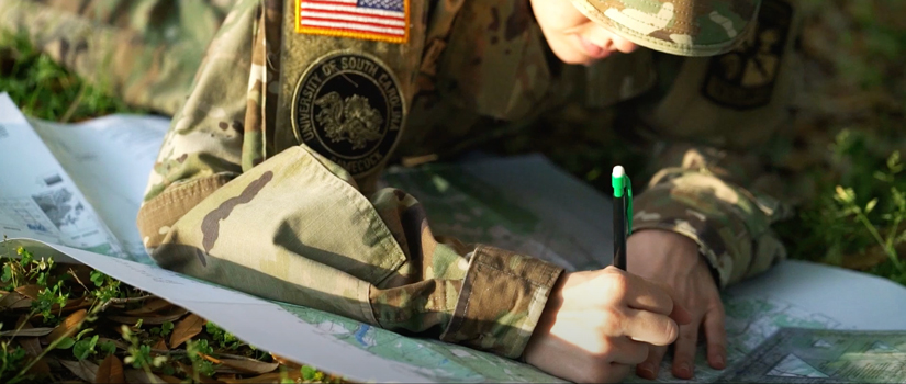 Army ROTC Cadet with map
