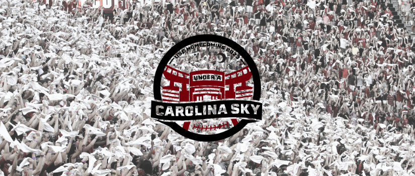 USC Homecoming logo saying "Under a Carolina Sky - USC Homecoming 2023." The log has an outline of Williams-Brice Stadium and a crescent moon. The background of the banner image is a faded picture of the football student section holding up white rally towels.