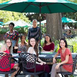 group of students at a patio table