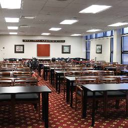rows of desks in a carpeted room
