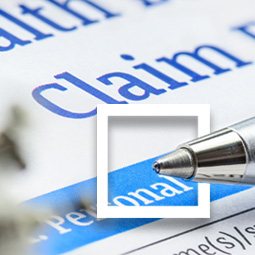 Closeup of a pen on a health insurance claim form